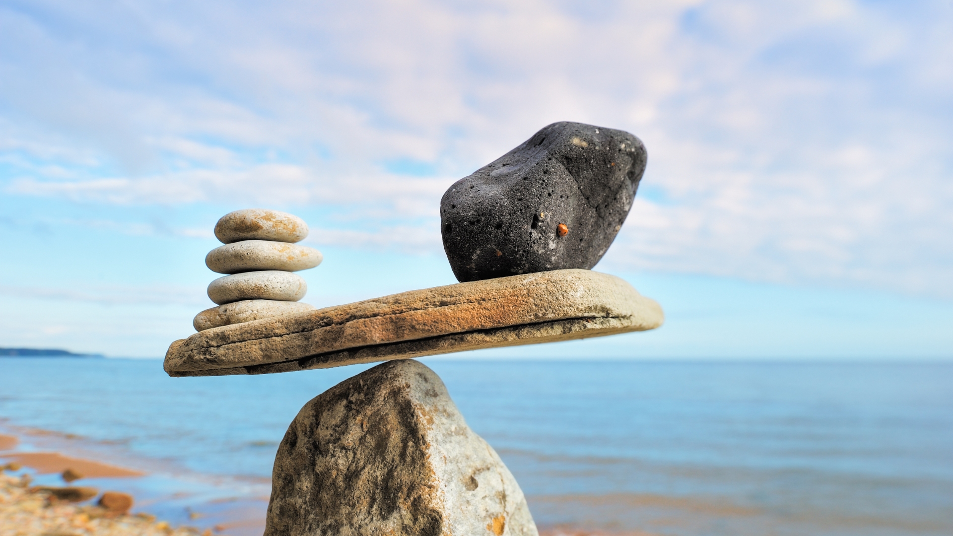 rocks balancing on another rock at the beach