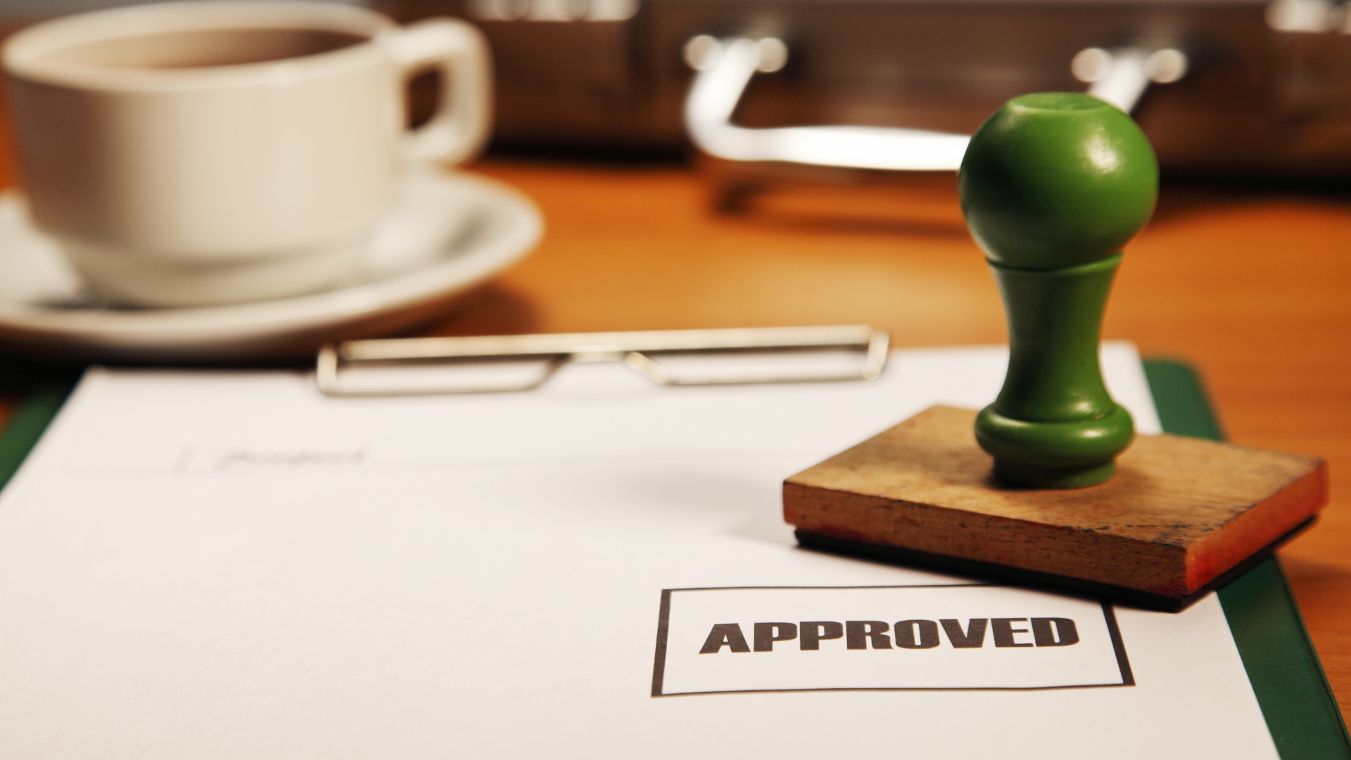 piece of paper with an "approval" stamp
