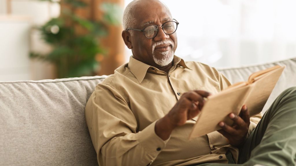 Man reading on the couch.