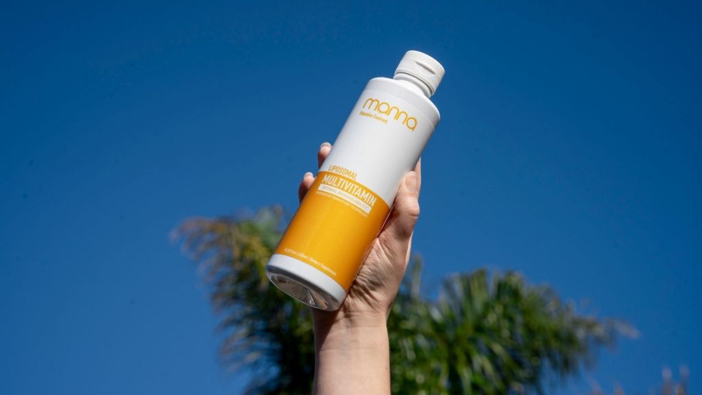 manna multivitamin bottle in the air