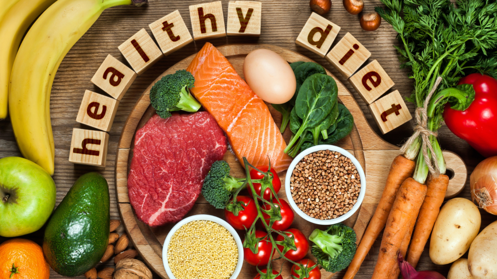 healthy diet written in block letters surrounded by fruits, veggies and meats