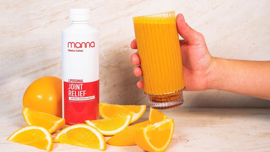 Manna's joint relief bottle with oranges and person holding smoothie