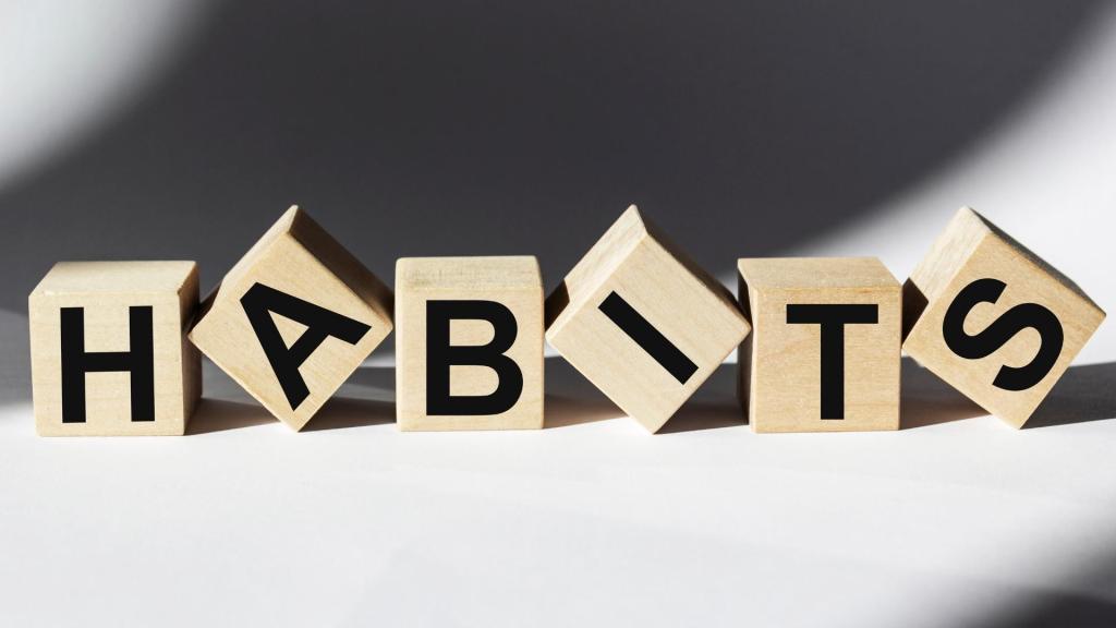 The word "Habits" spelled out in wooden blocks.