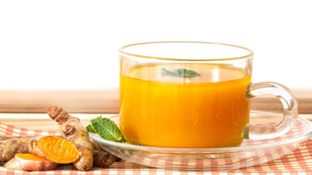 Turmeric tea in a glass mug