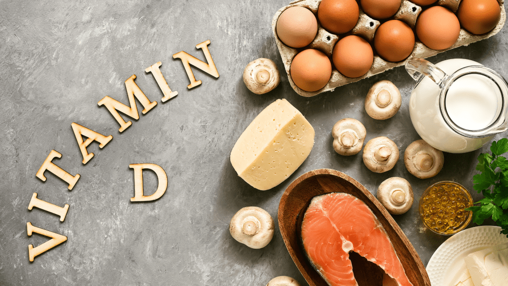 Vitamin D written on board with sources including eggs, mushrooms, salmon and more.