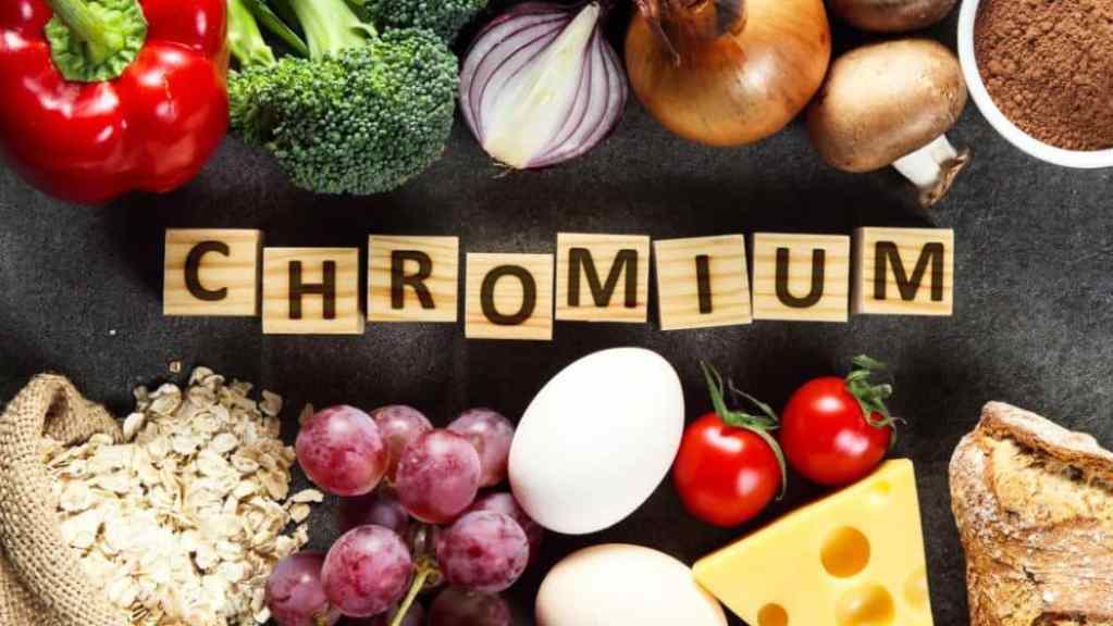 Various foods rich in chromium arranged around the word "chromium" spelled out in letter tiles.