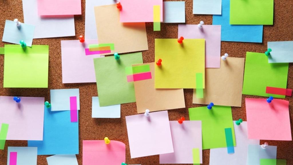 Bulletin board filled with sticky notes