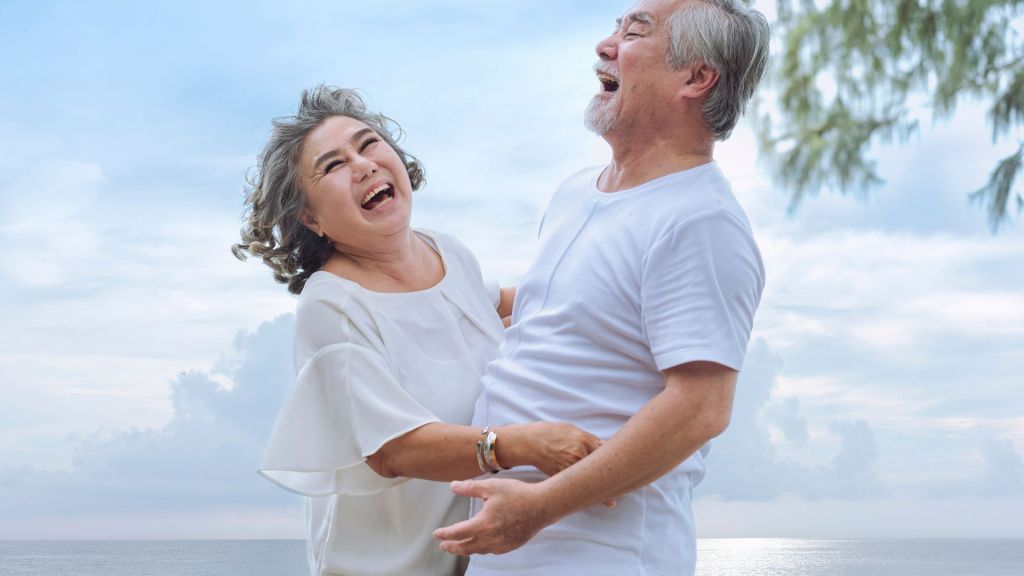 senior couple happy in the beach