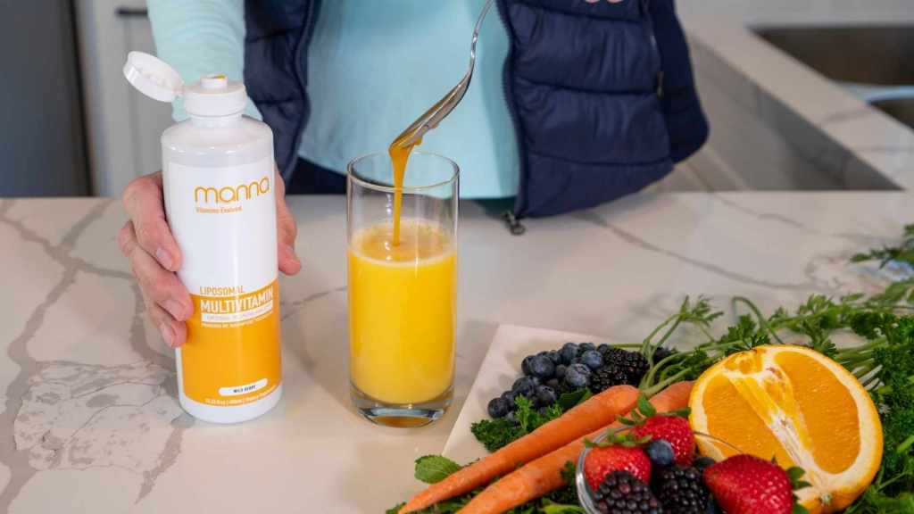 bottle of manna multivitamin on the counter with fruits