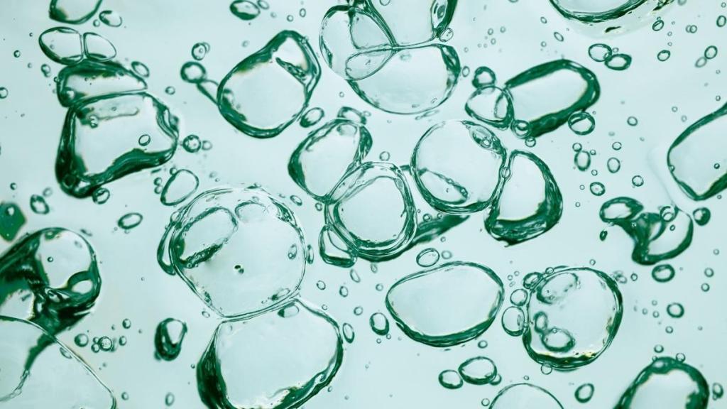 Light blue bubbles in liquid.