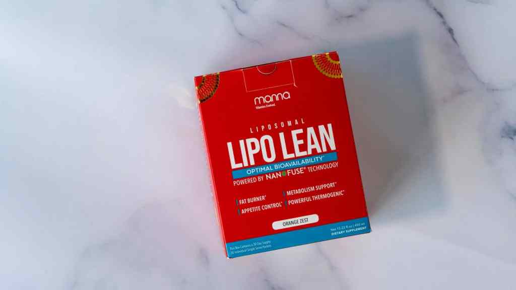 Box of liposomal dietary supplement called "Lipo Lean" with orange zest flavor, designed for fat burning, metabolism support, and appetite control, on a marble surface.